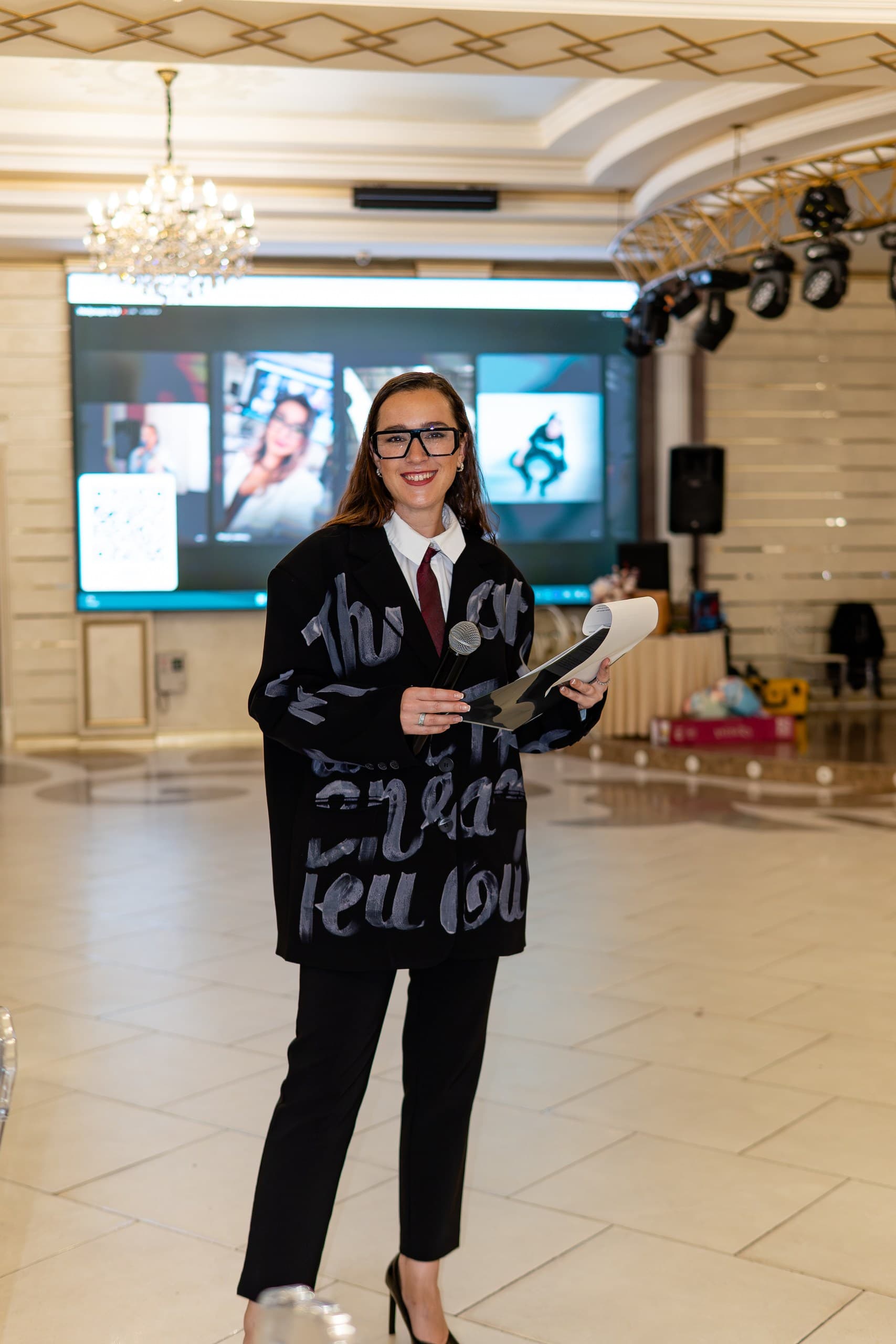 Host in front of the HypeWall screen