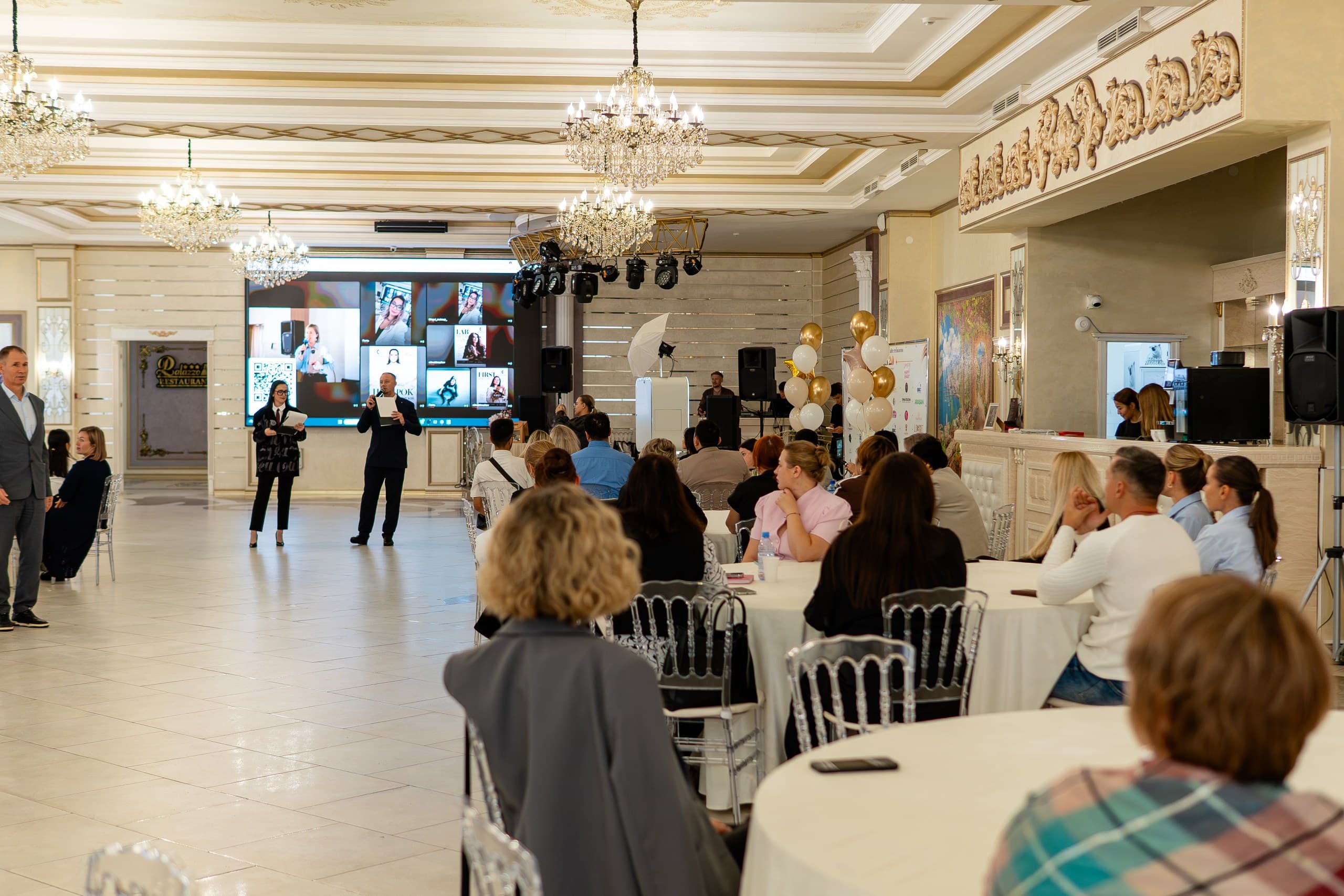 Neuroceh 2.0 guests watching the photo wall